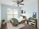 bedroom featuring neutral paint, dark floors, and a window with blinds at 4219 David Austin Ct, Snellville, GA 30039