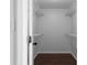 Walk-in closet with plenty of wire shelving, and hardwood-style floor at 4219 David Austin Ct, Snellville, GA 30039