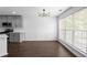 Dining area with modern chandelier, gray walls, and windows providing ample natural light at 4219 David Austin Ct, Snellville, GA 30039