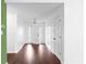 Bright foyer with hardwood floors, white walls, and a stylish light fixture welcoming guests into the home at 4219 David Austin Ct, Snellville, GA 30039