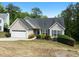 Charming single-Gathering home featuring a two-car garage and well-maintained landscaping at 4219 David Austin Ct, Snellville, GA 30039