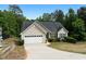Charming single-Gathering home featuring a two-car garage and well-maintained landscaping at 4219 David Austin Ct, Snellville, GA 30039