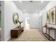 Bright hallway featuring a round mirror and neutral decor at 4219 David Austin Ct, Snellville, GA 30039