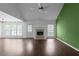 Spacious living room featuring vaulted ceilings, a fireplace, large windows, and hardwood style floors at 4219 David Austin Ct, Snellville, GA 30039