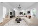 Open floorplan living room with modern furniture, staircase, and decor at 4219 David Austin Ct, Snellville, GA 30039