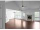 Bright living room with a brick fireplace, vaulted ceilings, and large windows offering natural light at 4219 David Austin Ct, Snellville, GA 30039