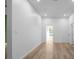 Living room with white walls, recessed lights and light-colored wood floors at 4219 David Austin Ct, Snellville, GA 30039