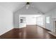 Spacious living room boasts a vaulted ceiling, fireplace, and an open layout to the kitchen at 4219 David Austin Ct, Snellville, GA 30039