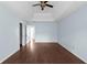This main bedroom features wood floors, light blue walls, and multiple entry points at 4219 David Austin Ct, Snellville, GA 30039