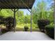 Outdoor patio with views of a lush, green backyard and surrounding trees at 4219 David Austin Ct, Snellville, GA 30039
