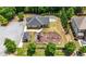Aerial view of the community clubhouse and playground, with parking lot and a fire pit at , Atlanta, GA 30349