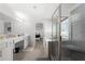 Bathroom featuring double vanity, tiled floor, large mirrors, and glass shower stall at , Atlanta, GA 30349