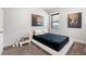 Modern bedroom with unique artwork and plush carpet; a tranquil space for relaxation at , Atlanta, GA 30349