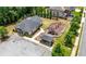 An aerial view of the community clubhouse with playground, fire pit, and parking lot at , Atlanta, GA 30349
