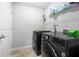 Well-equipped laundry room with modern washer and dryer units at , Atlanta, GA 30349