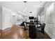 Open-concept living room with hardwood floors, modern lighting, and sleek, contemporary furniture at , Atlanta, GA 30349