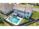 Aerial view of a private backyard pool with a gazebo, spa, and neat landscaping at , Atlanta, GA 30349