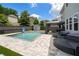 Backyard featuring a swimming pool, covered outdoor lounge area, and privacy fence at , Atlanta, GA 30349