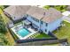 Aerial view of a private backyard pool with a gazebo, spa, and neat landscaping at , Atlanta, GA 30349