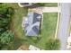 An aerial view of a charming home with a well-manicured lawn, patio and long driveway at 225 Ruby Forest Pkwy, Suwanee, GA 30024