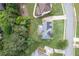 A high angle shows the well-manicured lot, landscaping and hardscape of this community home at 225 Ruby Forest Pkwy, Suwanee, GA 30024