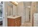 Bathroom featuring vanity, stone tile floor, and walk in shower at 225 Ruby Forest Pkwy, Suwanee, GA 30024
