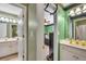 Bathrooms featuring double vanity, a large mirror, and a view into the bedroom at 225 Ruby Forest Pkwy, Suwanee, GA 30024