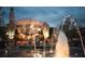 Captured at night, the city hall glows behind the fountain in the square at 225 Ruby Forest Pkwy, Suwanee, GA 30024