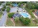 Aerial view of community pool and recreational area with mature trees and plentiful parking at 225 Ruby Forest Pkwy, Suwanee, GA 30024