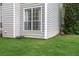 Grey siding on a home's exterior and next to a well-maintained lawn at 225 Ruby Forest Pkwy, Suwanee, GA 30024