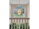 Foyer featuring a modern chandelier and a view of the front yard through an arched window at 225 Ruby Forest Pkwy, Suwanee, GA 30024