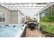 Outdoor entertaining area with a hot tub, dining table, and pergola, perfect for gatherings at 225 Ruby Forest Pkwy, Suwanee, GA 30024