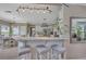 Bright kitchen features white cabinets, stainless steel appliances, a marble countertop and pendant lighting at 225 Ruby Forest Pkwy, Suwanee, GA 30024