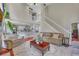 Inviting living room featuring an open floor plan and a staircase leading to the upper level at 225 Ruby Forest Pkwy, Suwanee, GA 30024