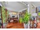 Inviting office space with hardwood floors, detailed trim, a large desk, and beautiful plants at 225 Ruby Forest Pkwy, Suwanee, GA 30024