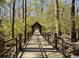 Scenic walking path winds through a serene wooded area, perfect for nature walks at 225 Ruby Forest Pkwy, Suwanee, GA 30024