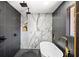 Luxury bathroom with a soaking tub, double shower head, and tiled walls at 2541 Peyton Woods Sw Trl, Atlanta, GA 30311