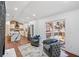 Living room with a view into the kitchen with stainless steel appliances and a waterfall island at 2541 Peyton Woods Sw Trl, Atlanta, GA 30311