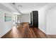 Bright living room with wood floors, modern fireplace, and sliding door access to the backyard at 2541 Peyton Woods Sw Trl, Atlanta, GA 30311