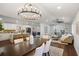 Spacious open floor plan featuring a kitchen island, dining table, and living area at 2541 Peyton Woods Sw Trl, Atlanta, GA 30311