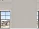 Light-filled bedroom with neutral walls, large windows, and backyard views at 5424 Gallagher Ct, Powder Springs, GA 30127
