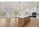 Bright kitchen featuring a central island, modern appliances, and plenty of cabinet space at 5424 Gallagher Ct, Powder Springs, GA 30127