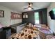 Bedroom with hardwood floors, a crib, a play area, and ample natural light at 6567 Post Rd, Douglasville, GA 30135