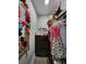 Walk-in closet is well organized with clothes, bows, and ample storage at 6567 Post Rd, Douglasville, GA 30135