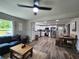 Bright, open-concept layout with comfortable seating, dining area, and a modern kitchen with stainless steel appliances at 6567 Post Rd, Douglasville, GA 30135
