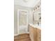 Well-lit bathroom featuring modern vanity, neutral countertops, and shower-tub combo with attractive tile surround at 1150 Collier Nw Rd # D20, Atlanta, GA 30318