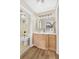 Well-lit bathroom featuring modern vanity, neutral countertops, and shower-tub combo with attractive tile surround at 1150 Collier Nw Rd # D20, Atlanta, GA 30318