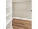 Walk-in closet with shelving and hardwood floors for organized storage at 1150 Collier Nw Rd # D20, Atlanta, GA 30318