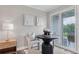 Cozy dining area with stylish chairs, a modern table, and natural light from a sliding door at 1150 Collier Nw Rd # D20, Atlanta, GA 30318