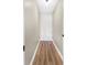 Narrow hallway with hardwood floors and neutral wall color at 1150 Collier Nw Rd # D20, Atlanta, GA 30318